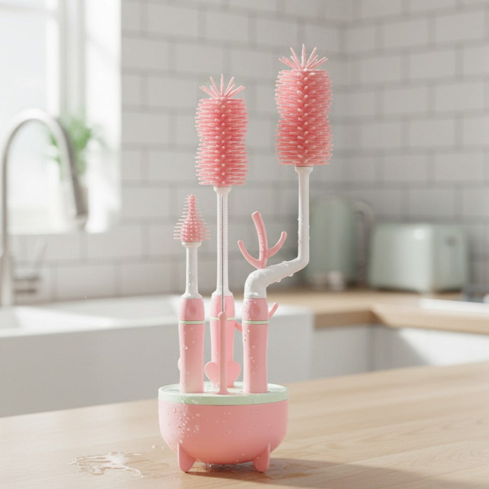 Set of pink bottle cleaning brushes with a holder on a kitchen counter.