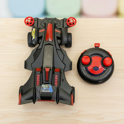 Toy car and remote control on a wooden surface