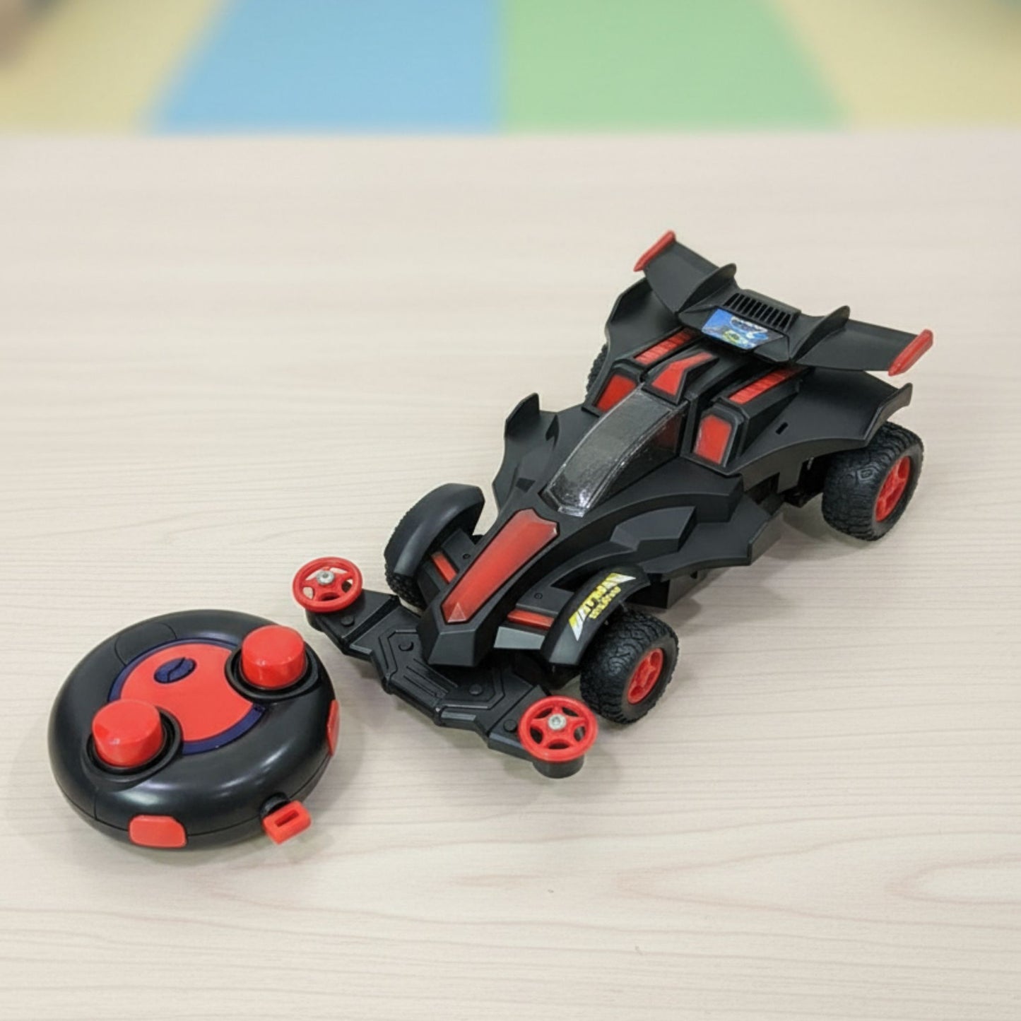 Toy vehicle with remote control on a light surface