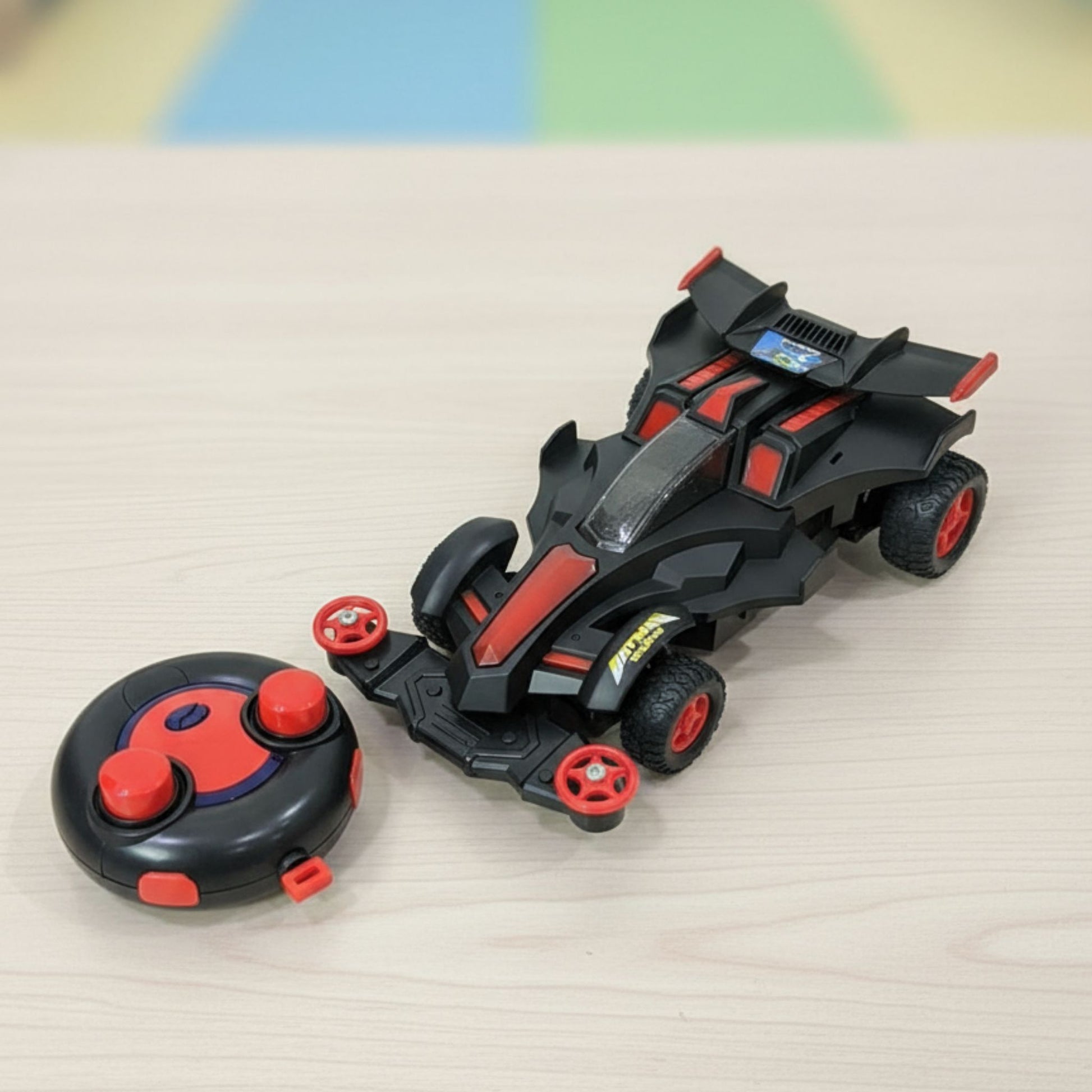 Toy vehicle with remote control on a light surface